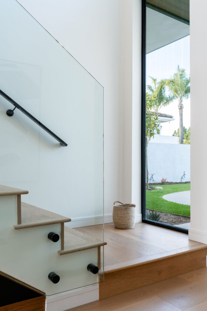 Stairs and window in a custom home in San Diego built by Townsgate Construction